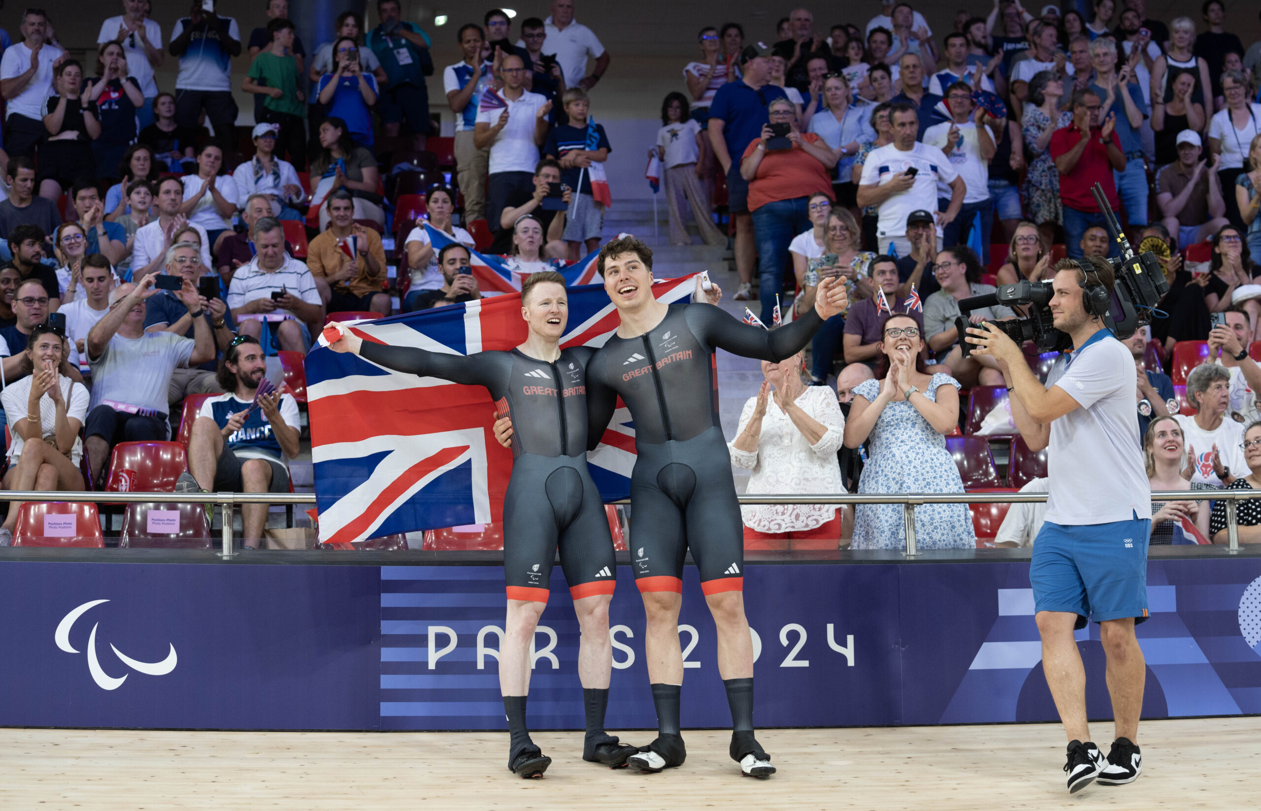 Image credit: imagecomms. ParalympicsGB Cyclists, James Ball aged 33, from Ponthir, Wales, pilot rider Steffan Lloyd aged 25, from Llandysul, Wales, wins gold in the Tandem B - 1000m Time Trial - Men event, at the Paris 2024 Paralympic Games.